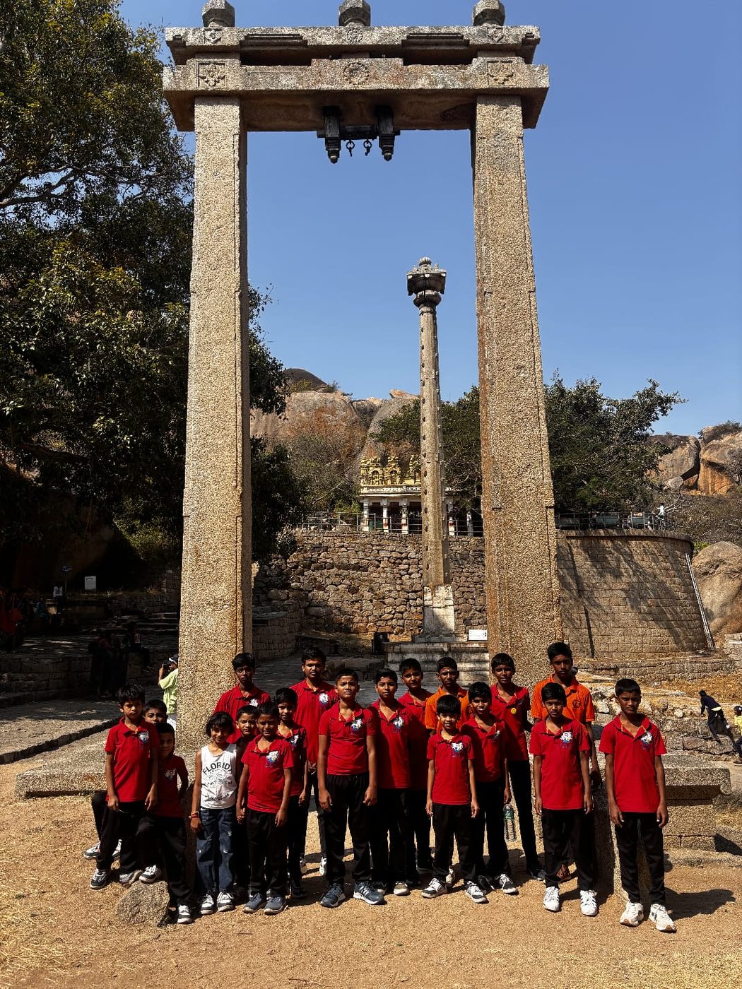 Group photo with hills in the background