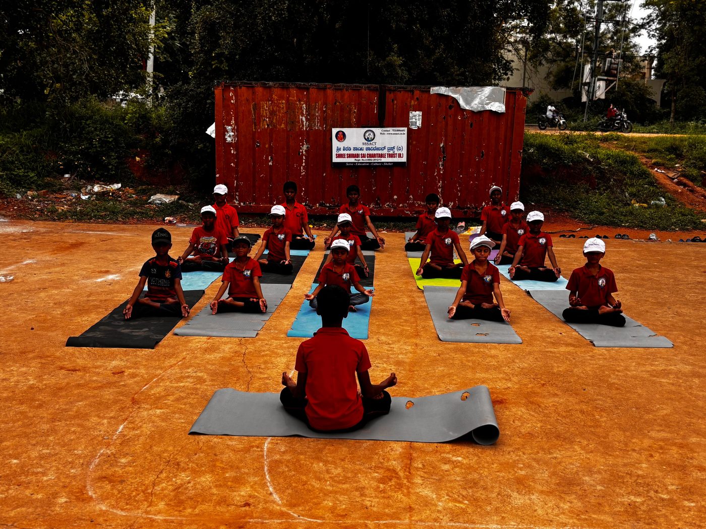 Children doing headstands at yoga day